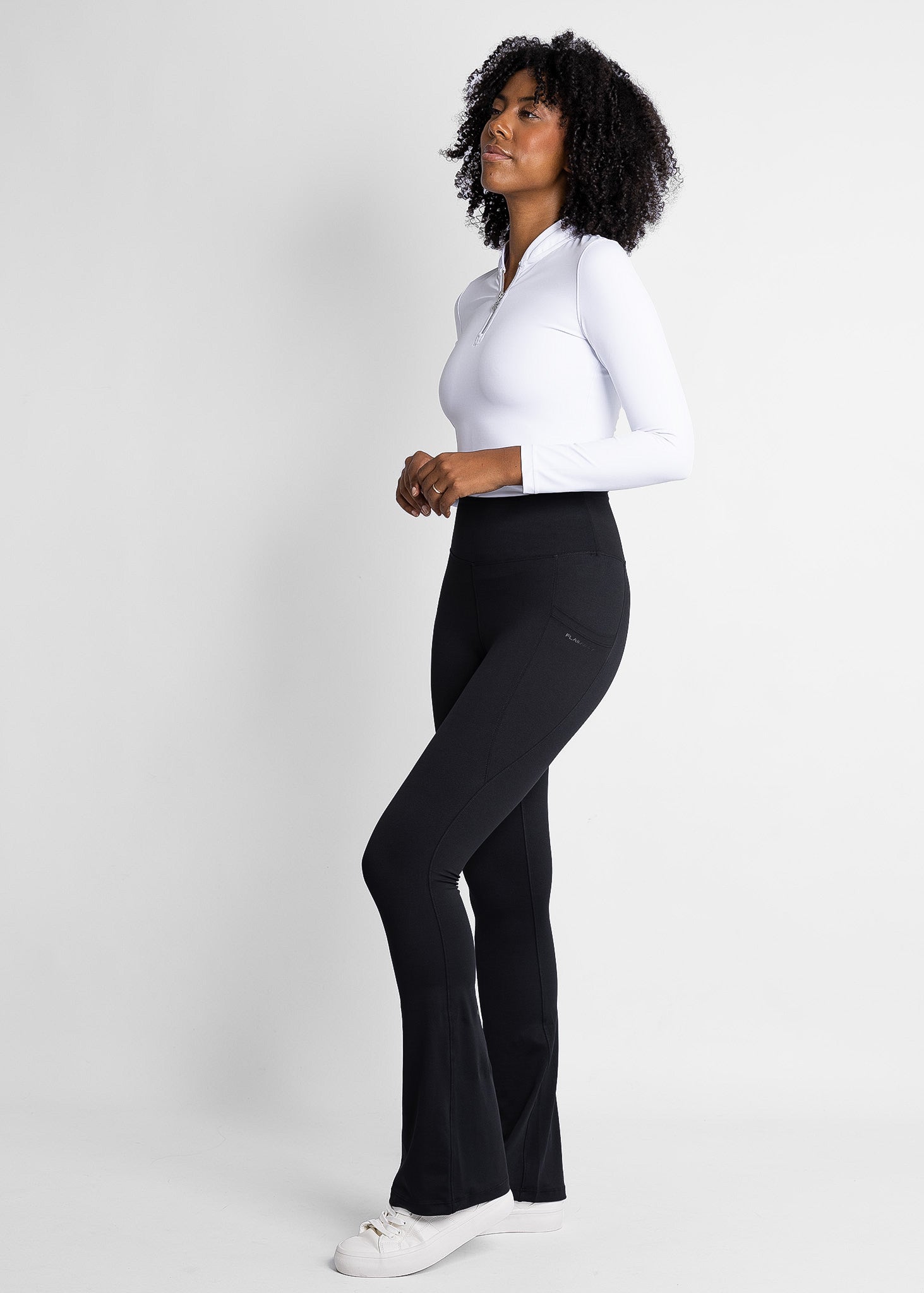 high-waisted, flare women golf leggings (black) featured with women golf base layer (white)