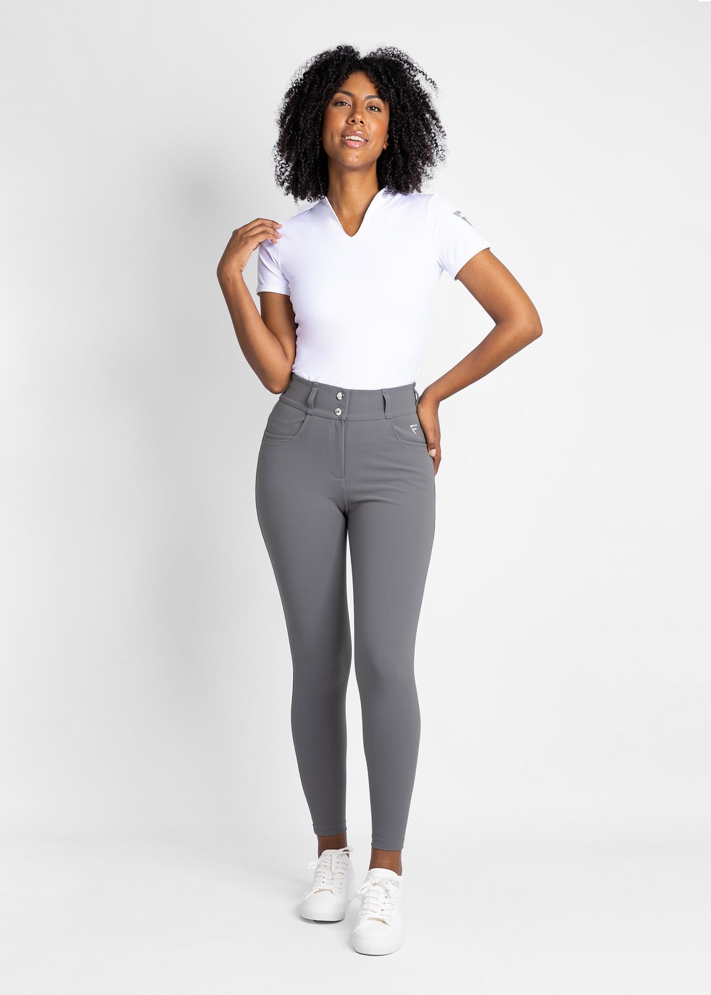 women high-waisted stretchy  golf pants (grey) featured with modern collarless golf shirt (white)