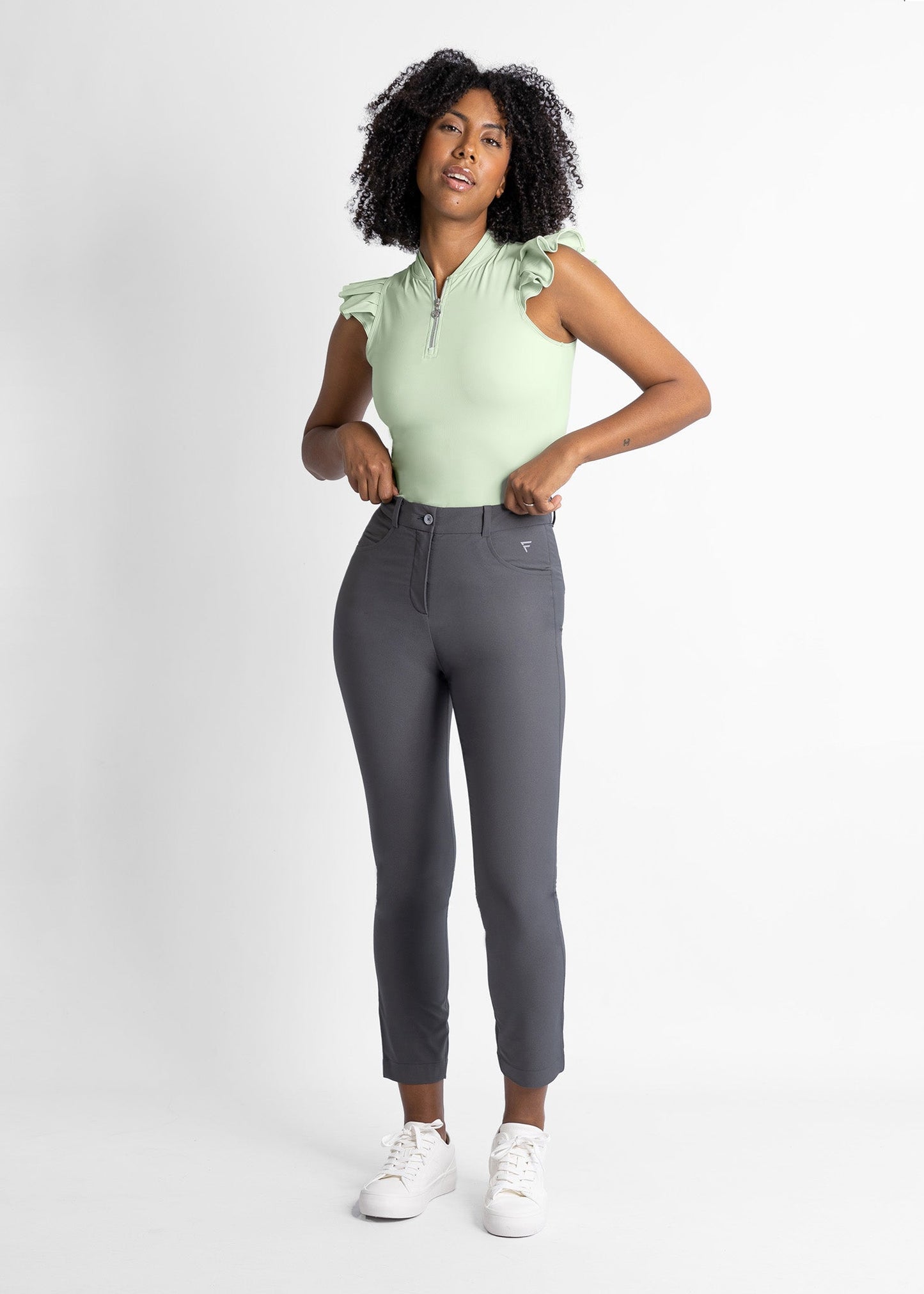 women high-waisted golf pants (volcanic ash) featured with sleeveless shirt with ruffle details (sage green)