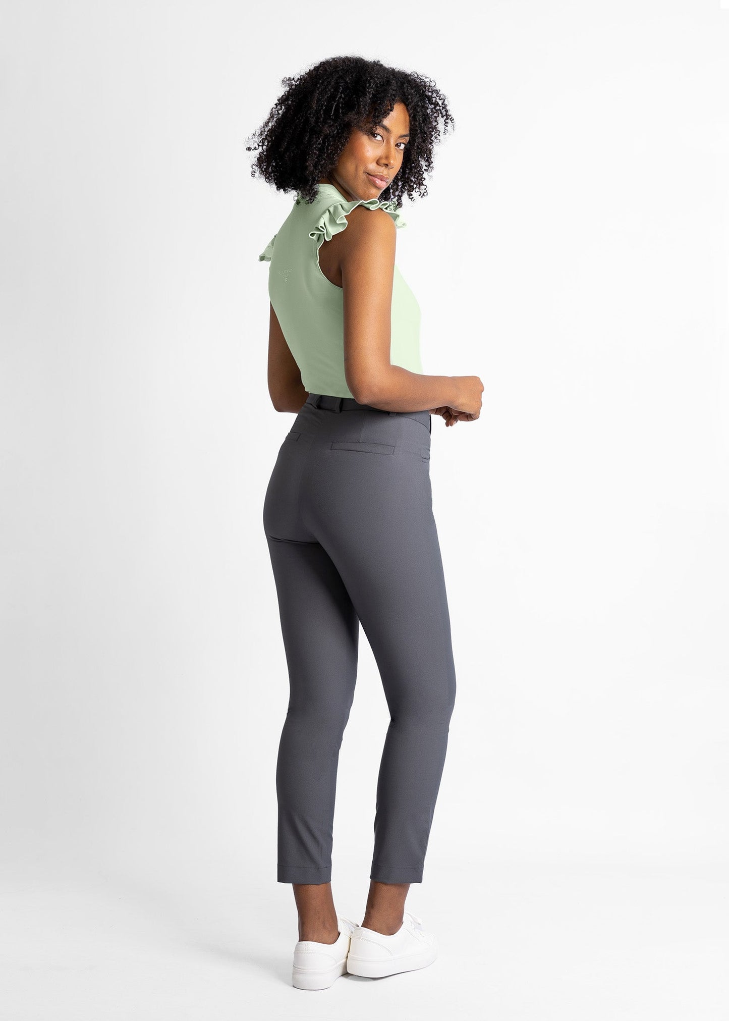 women high-waisted golf pants (volcanic ash) featured with sleeveless shirt with ruffle details (sage green)