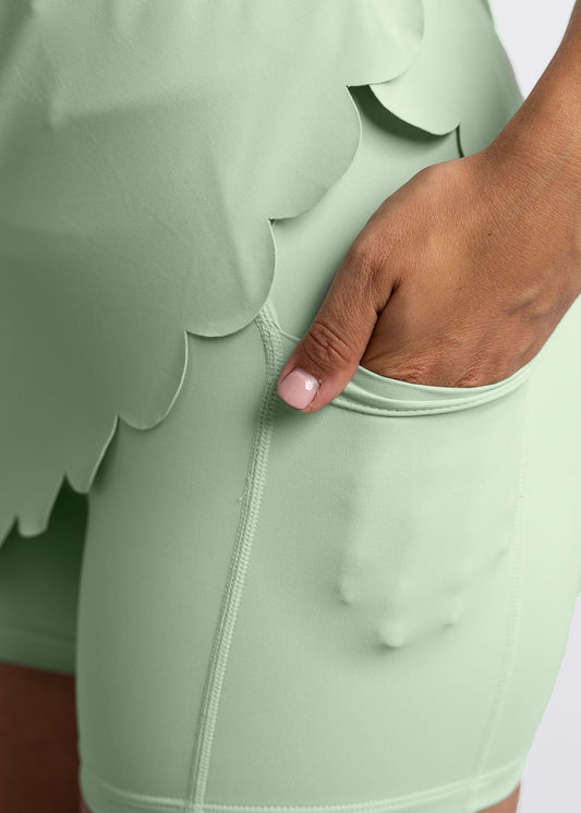 High-waisted golf skirt with scallop detail and inner skort that also has pockets (colour: sage green)