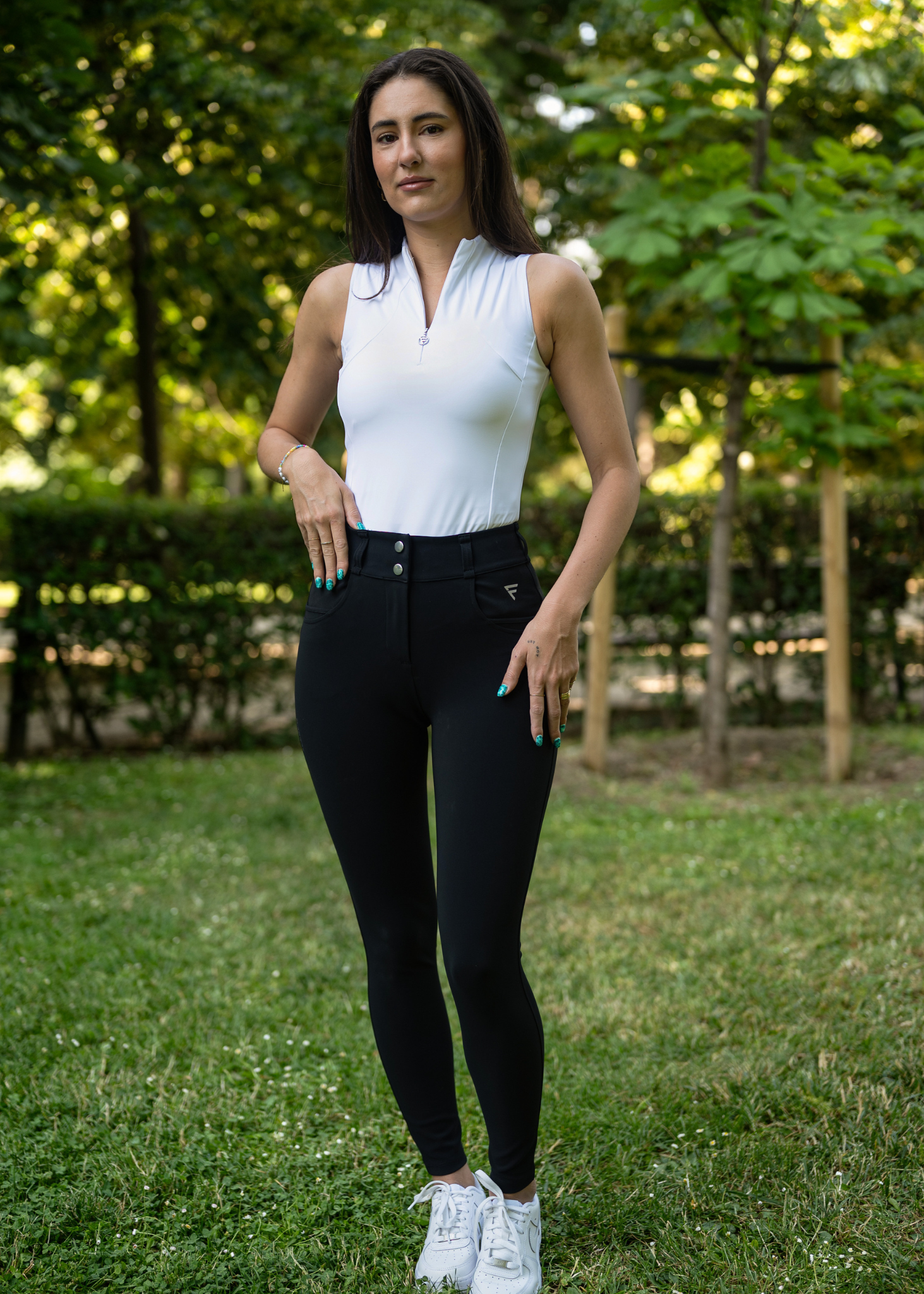 Black Golf Pants with white sleeveless golf shirt